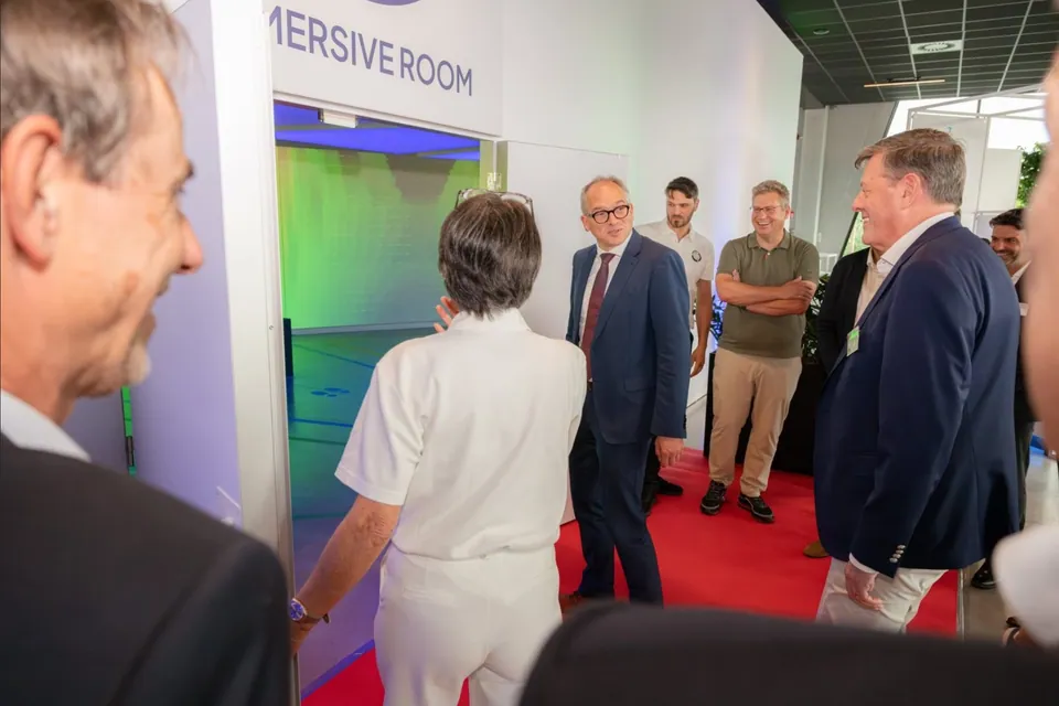 The first visitors walking into the immersive room