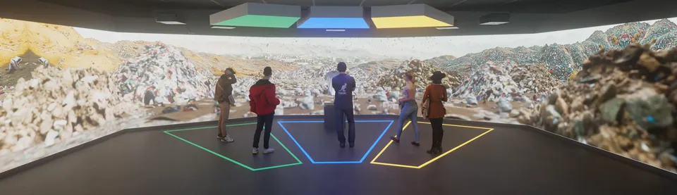 Visitors standing in the coloured floor zones in front of a waste landscape