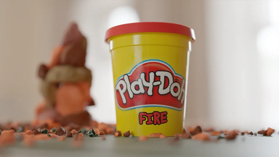 Play-Doh Fire tub with a clay flame sculpture behind it