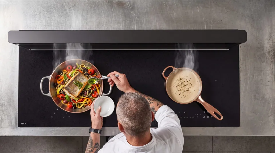 A chef cooking on a Novy hob, generated with Spaces