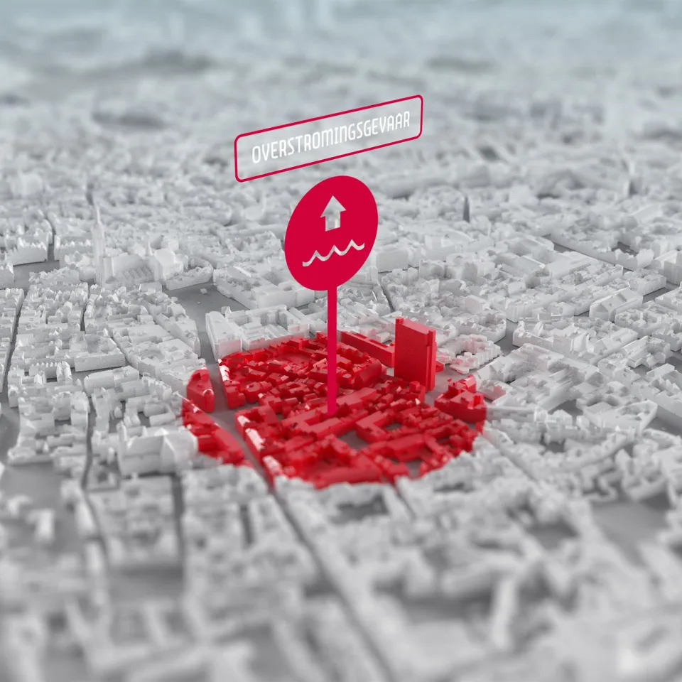 3D-printed Antwerp city model with a red highlighted building and info pin