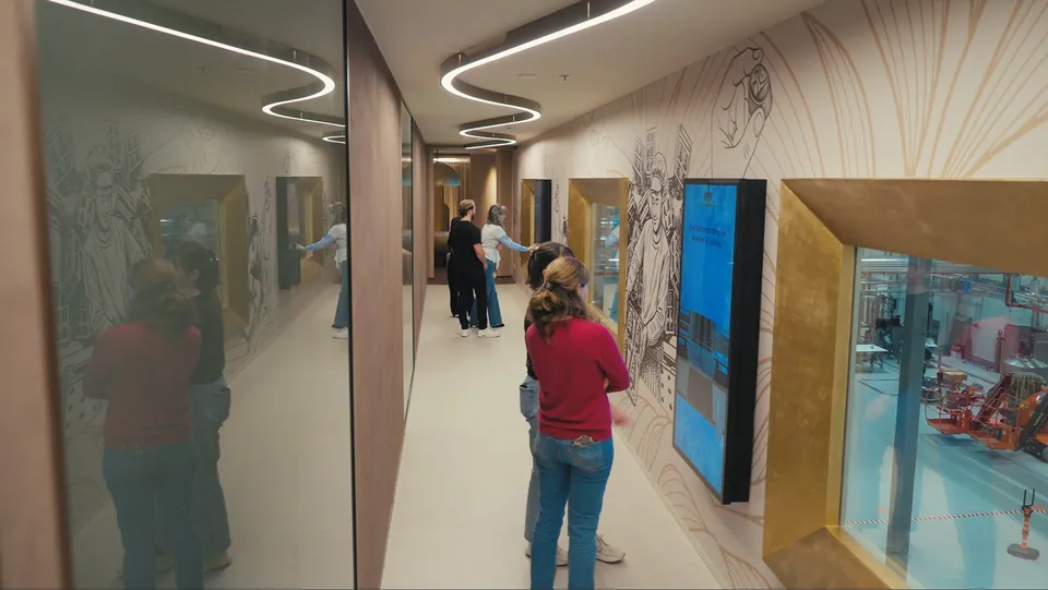 Visitors using the large praline touchscreen